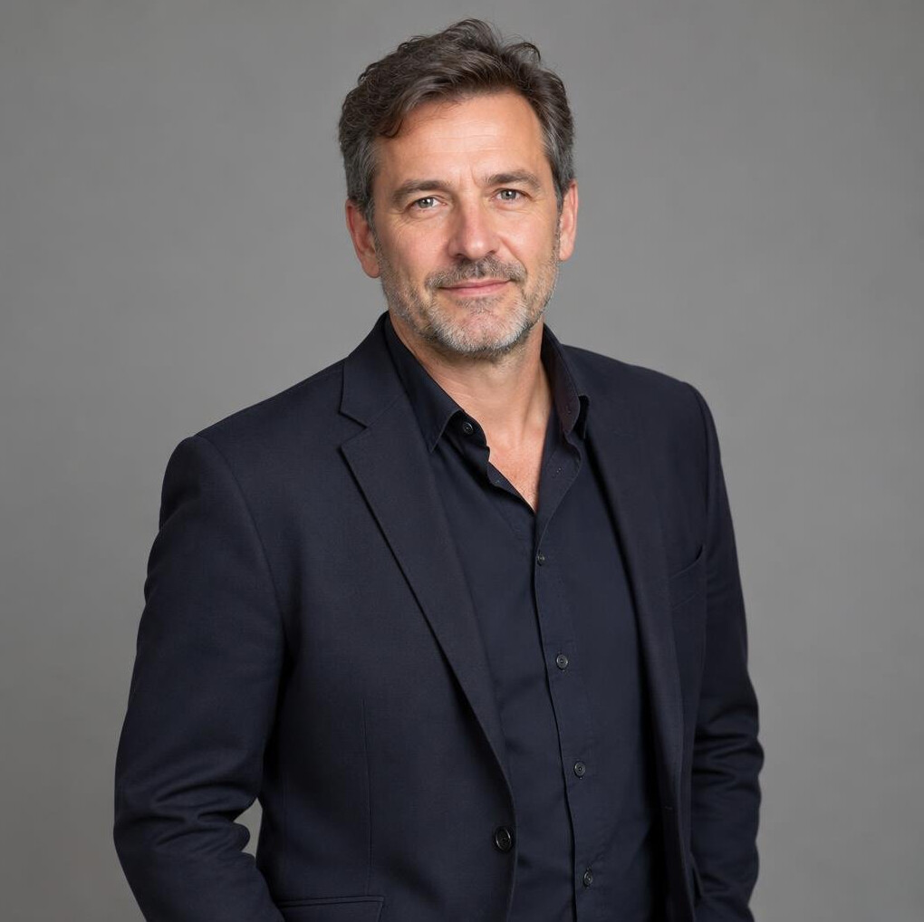 Portrait of a middle-aged man in a dark blazer